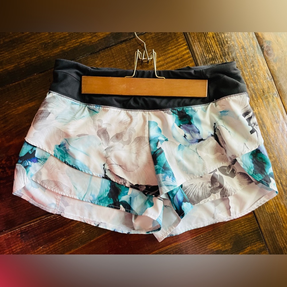 Calia by Carrie Underwood 
3” inseam blue, white floral 
Minimal wear, sz med.